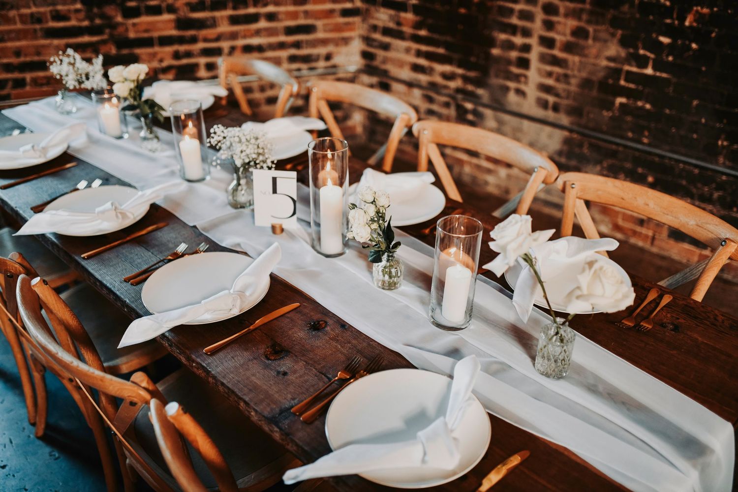 a dreamy table scape inside an industrial wedding venue in dallas located in the heart of deep ellum