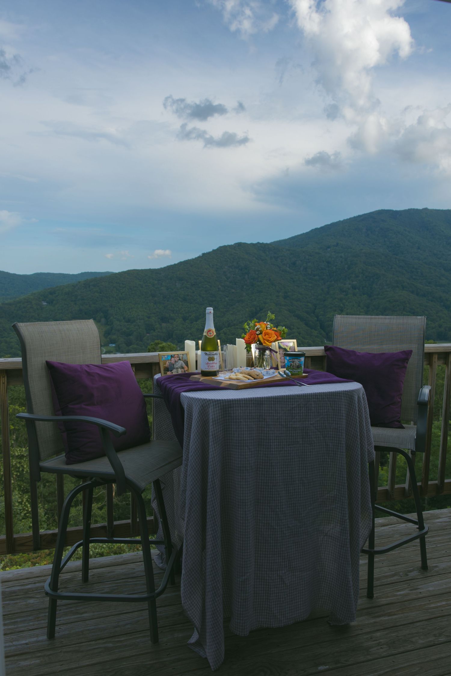 LGBTQ couple holding hands after romantic proposal at blue ridge mountain overlook near Asheville, North Carolina