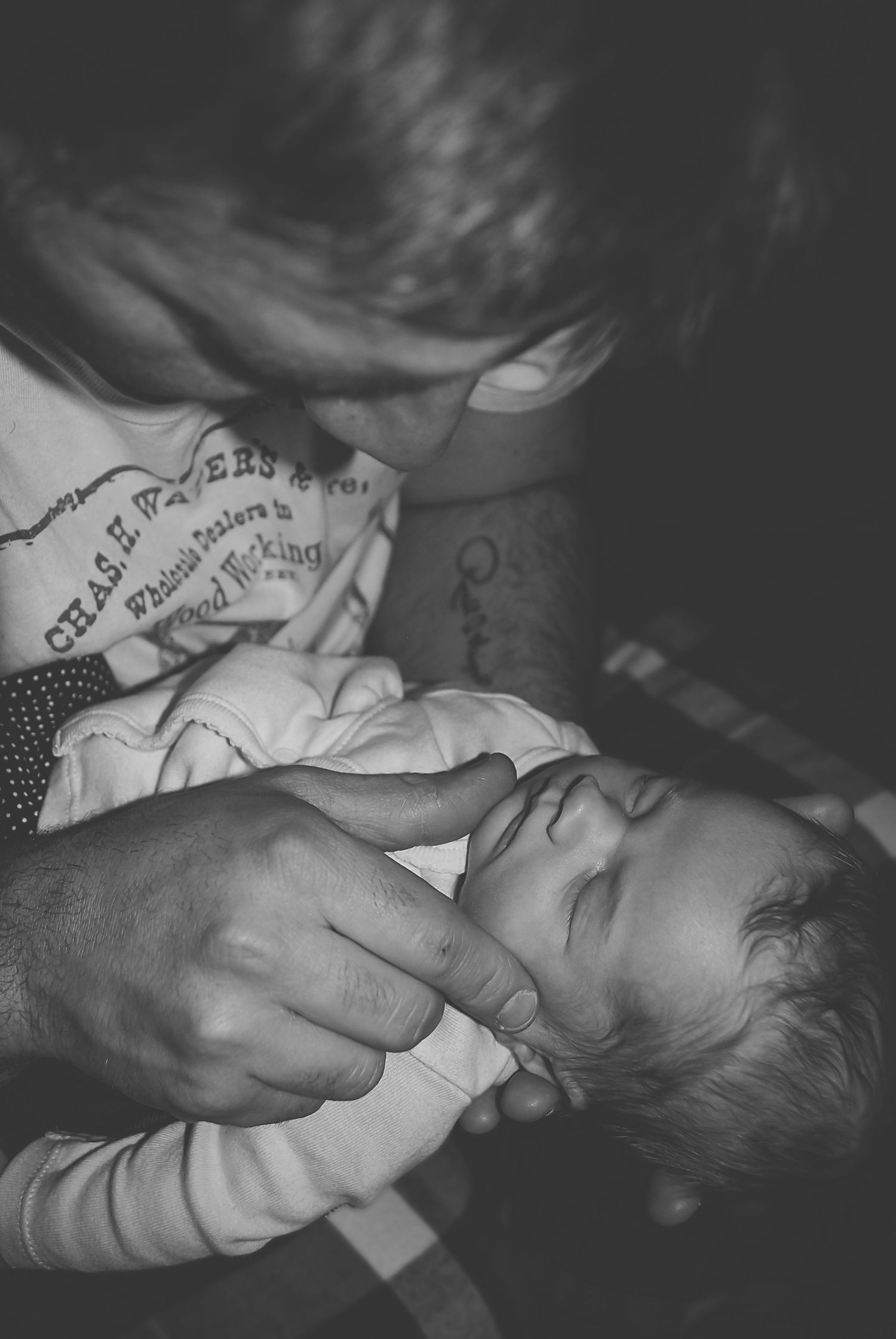 Artistic black and white newborn photography series showing peaceful sleeping moments.