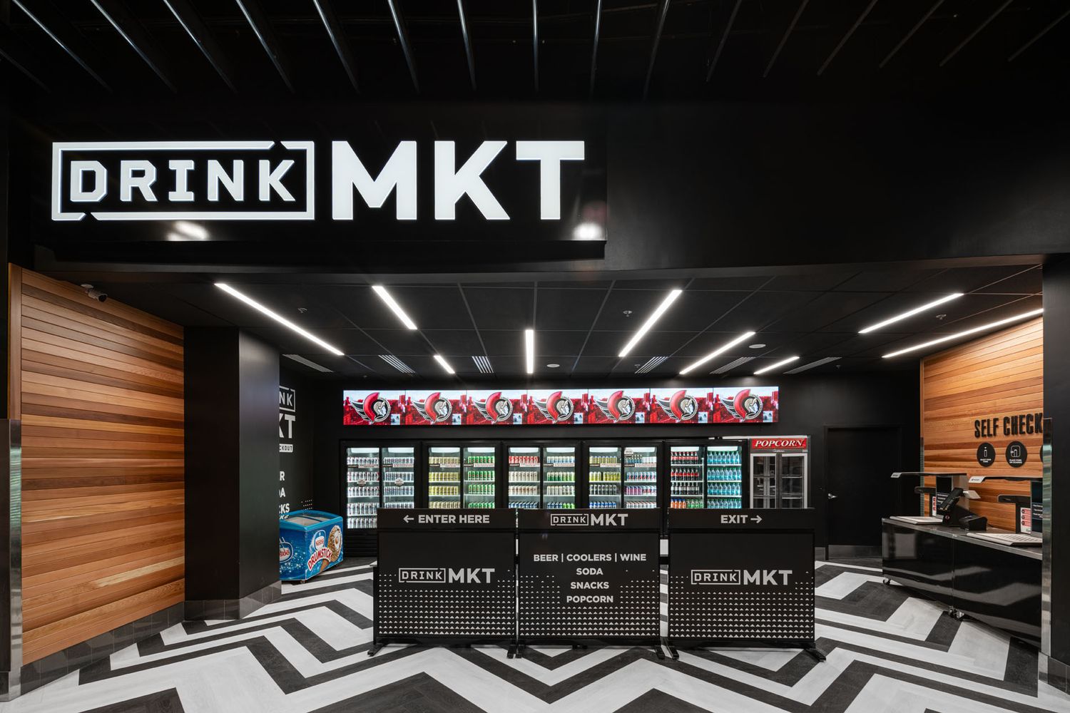 Commercial retail photography of Drink Mkt, featuring chevron flooring, wood slat walls, and modern LED integrated signage