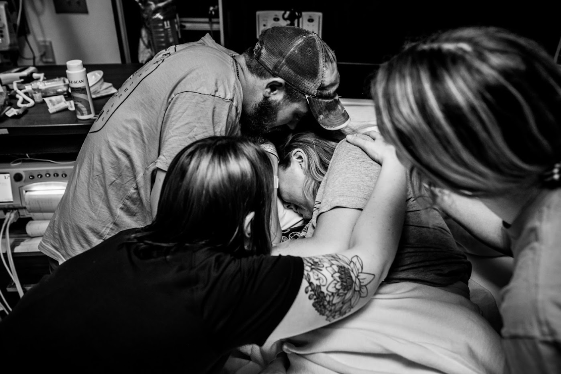 A series of black and white photos showing people working on tattoos in a professional tattoo studio.