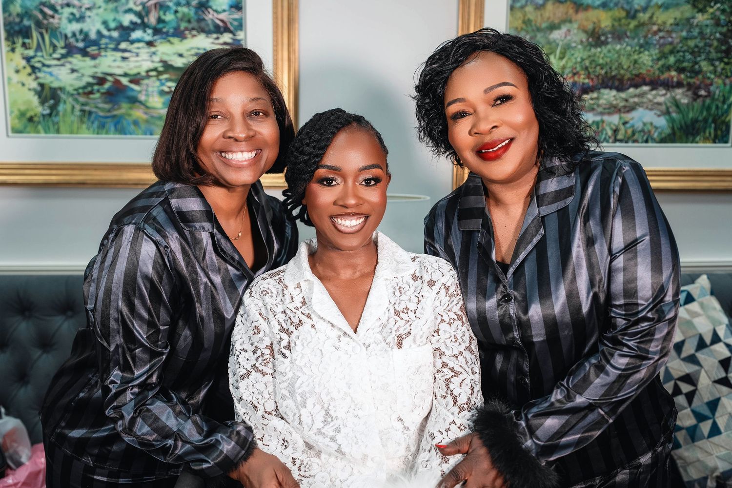 Three women smiling together, with the middle woman in a white lace dress flanked by two in matching shirts. Deerfield Golf Club Newark De