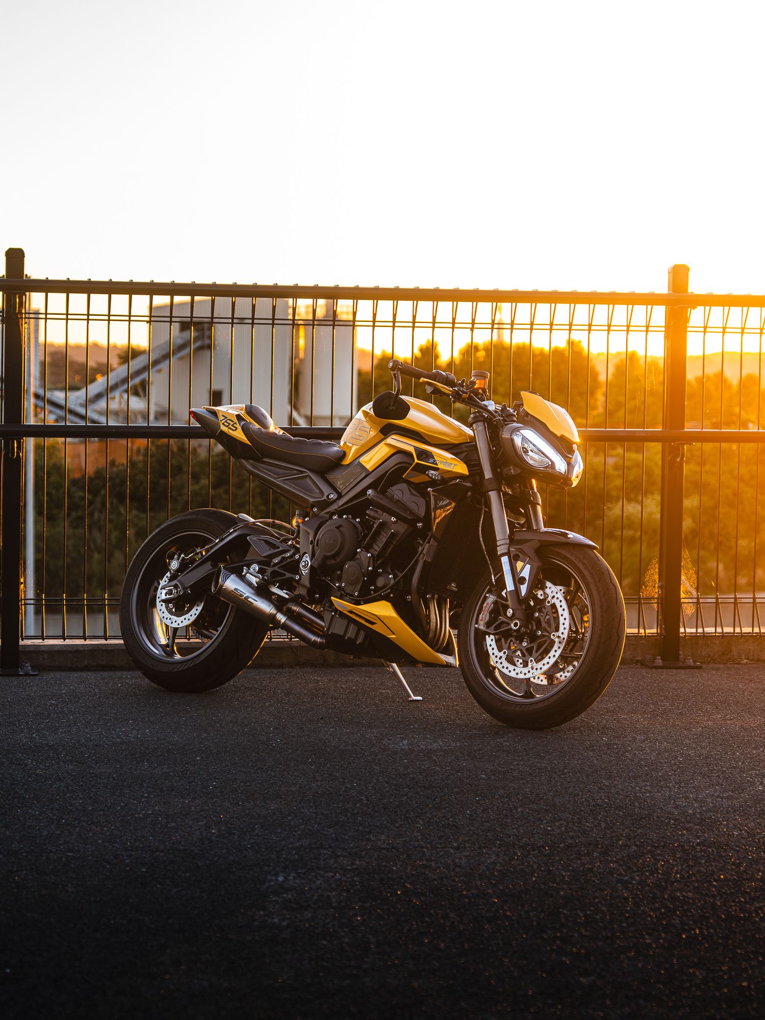 Yellow motorcycle at golden hour sunset