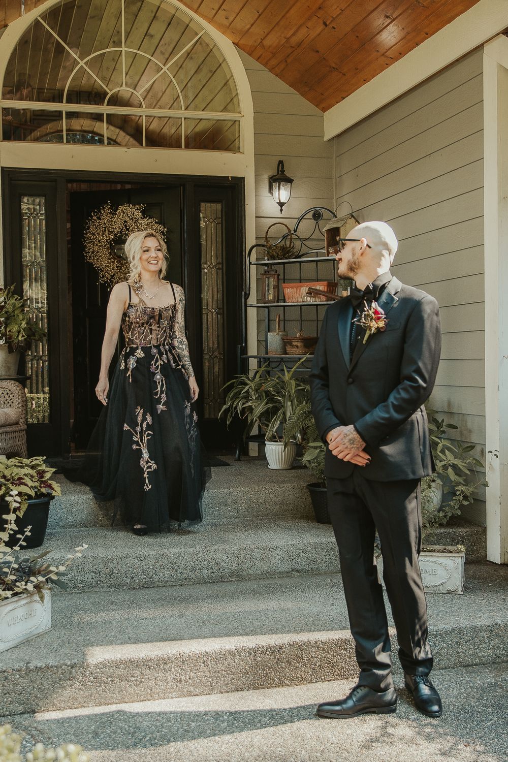 Moody couple first look with the bride in a gothic lace gown, the groom in a dark suit with spokane wedding photographer
