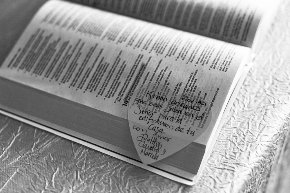 Close-up black and white photo of an open book page showing text listings.