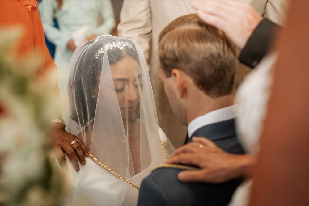 Intimate wedding ceremony moment with couple in traditional attire.