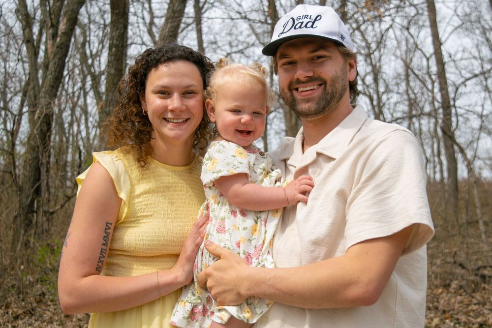 Family of three smiling