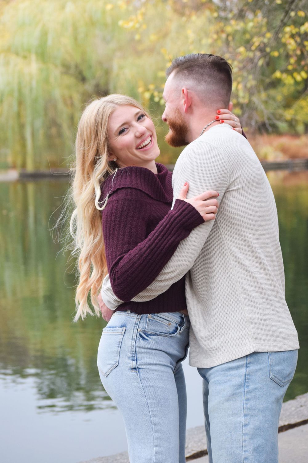 Couple hugging engagement session in Loose Park Kansas City