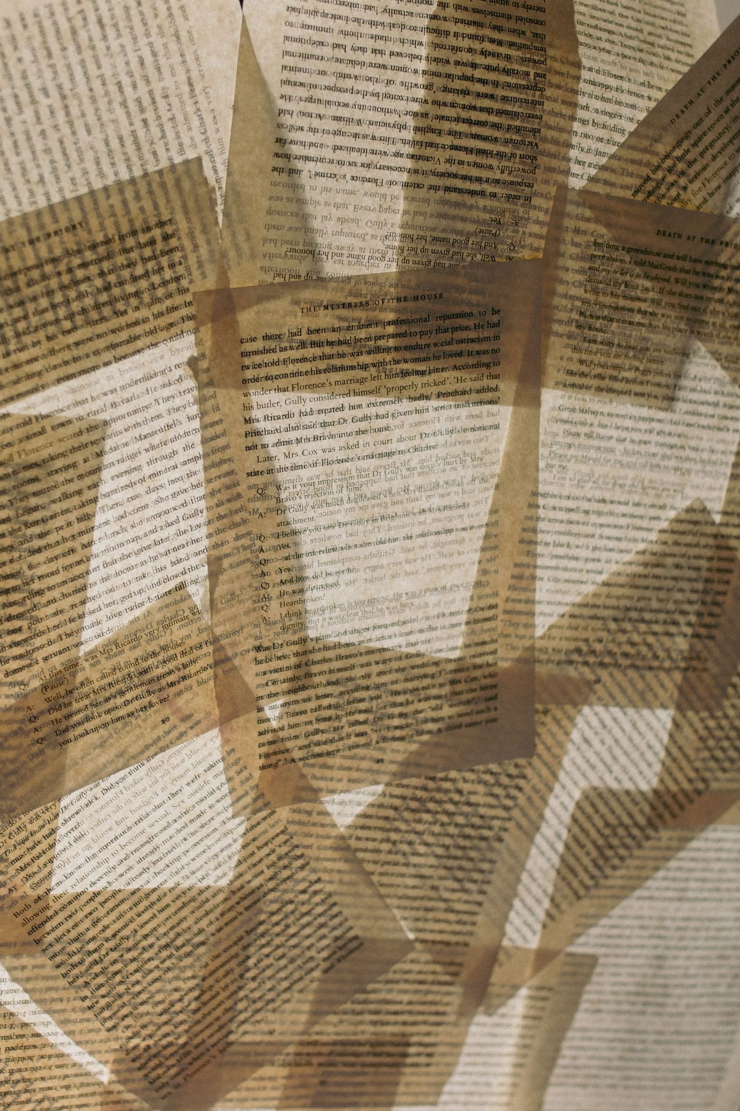 Abstract overlay of printed text pages creating geometric shadow patterns.