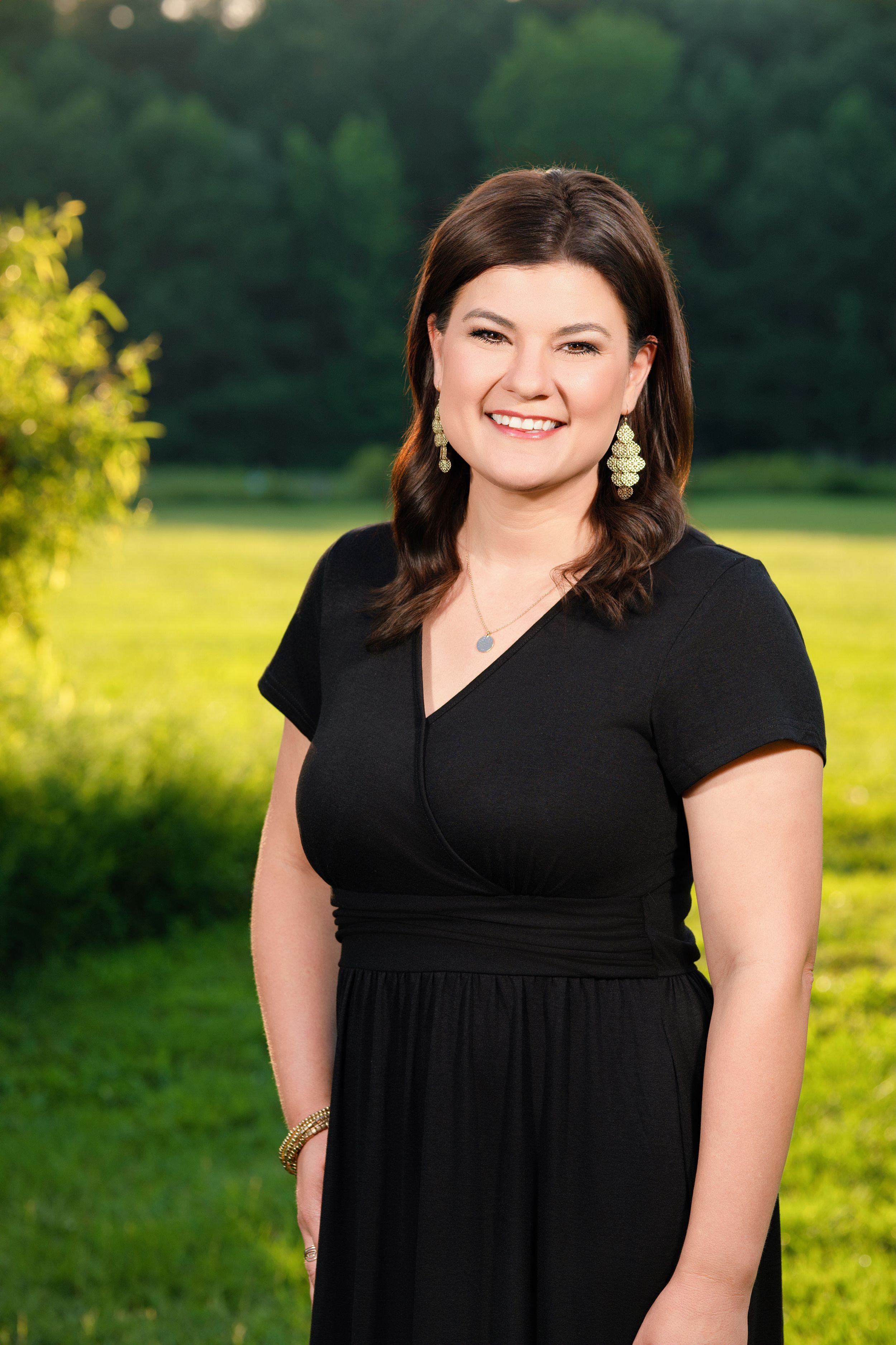 A series of outdoor portrait photos showing someone in a black dress against a green natural background at sunset.