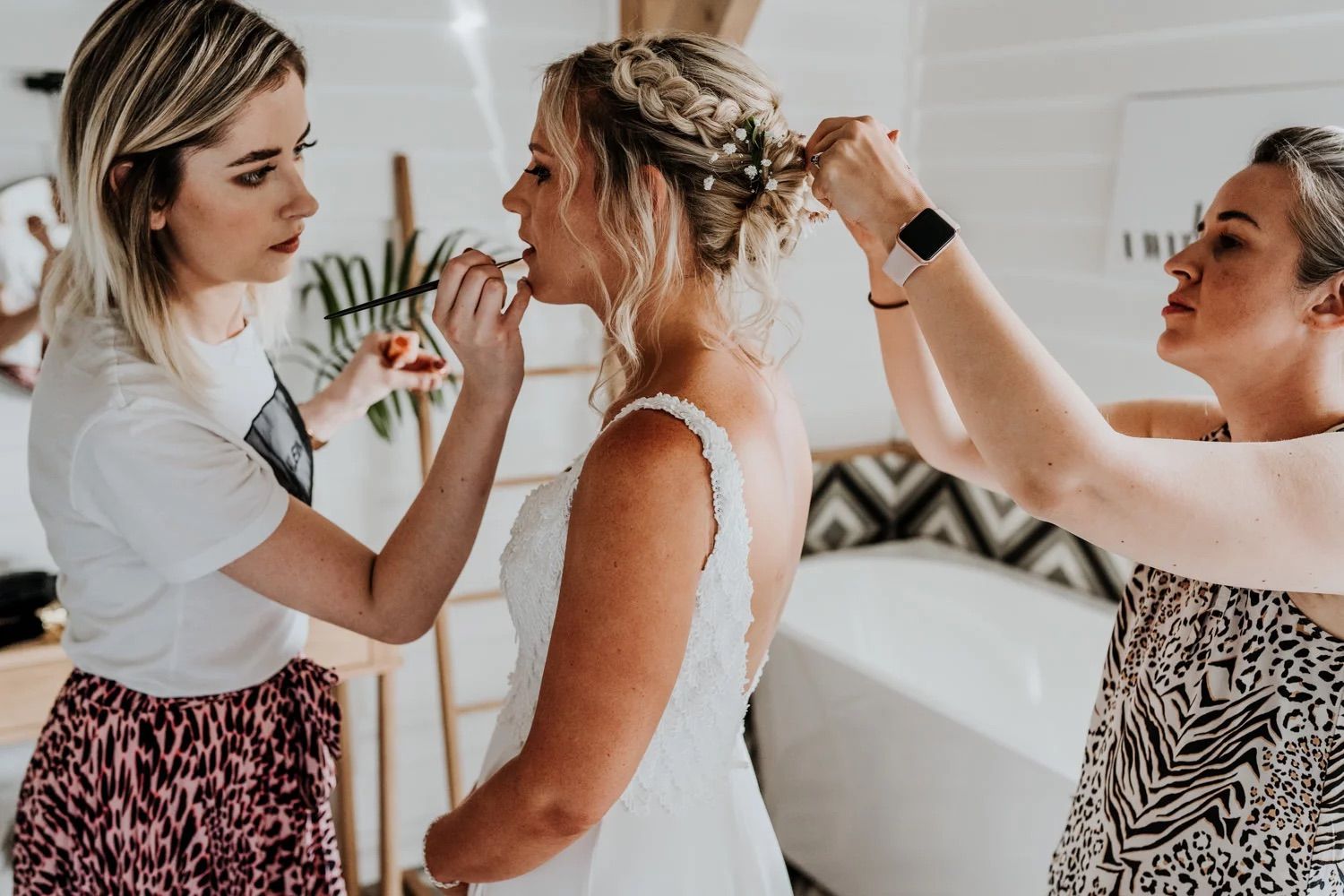Stylish wedding guests mingling and socializing at an indoor venue.