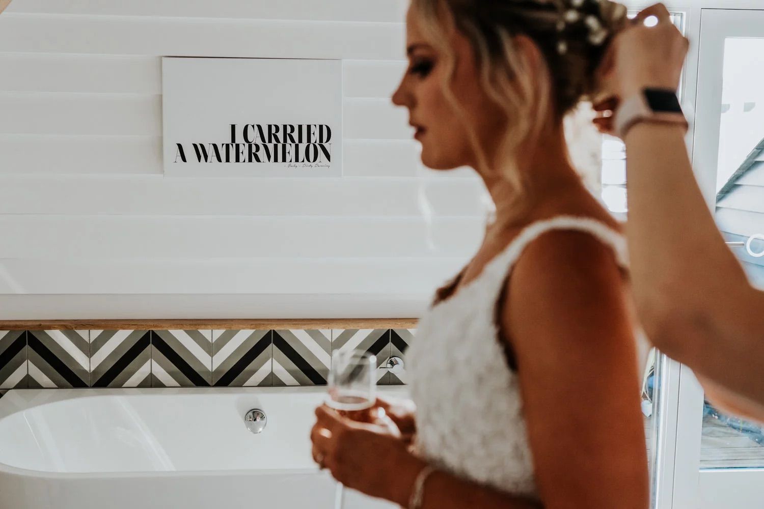 A bride and groom share an intimate moment with drinks during their wedding reception.