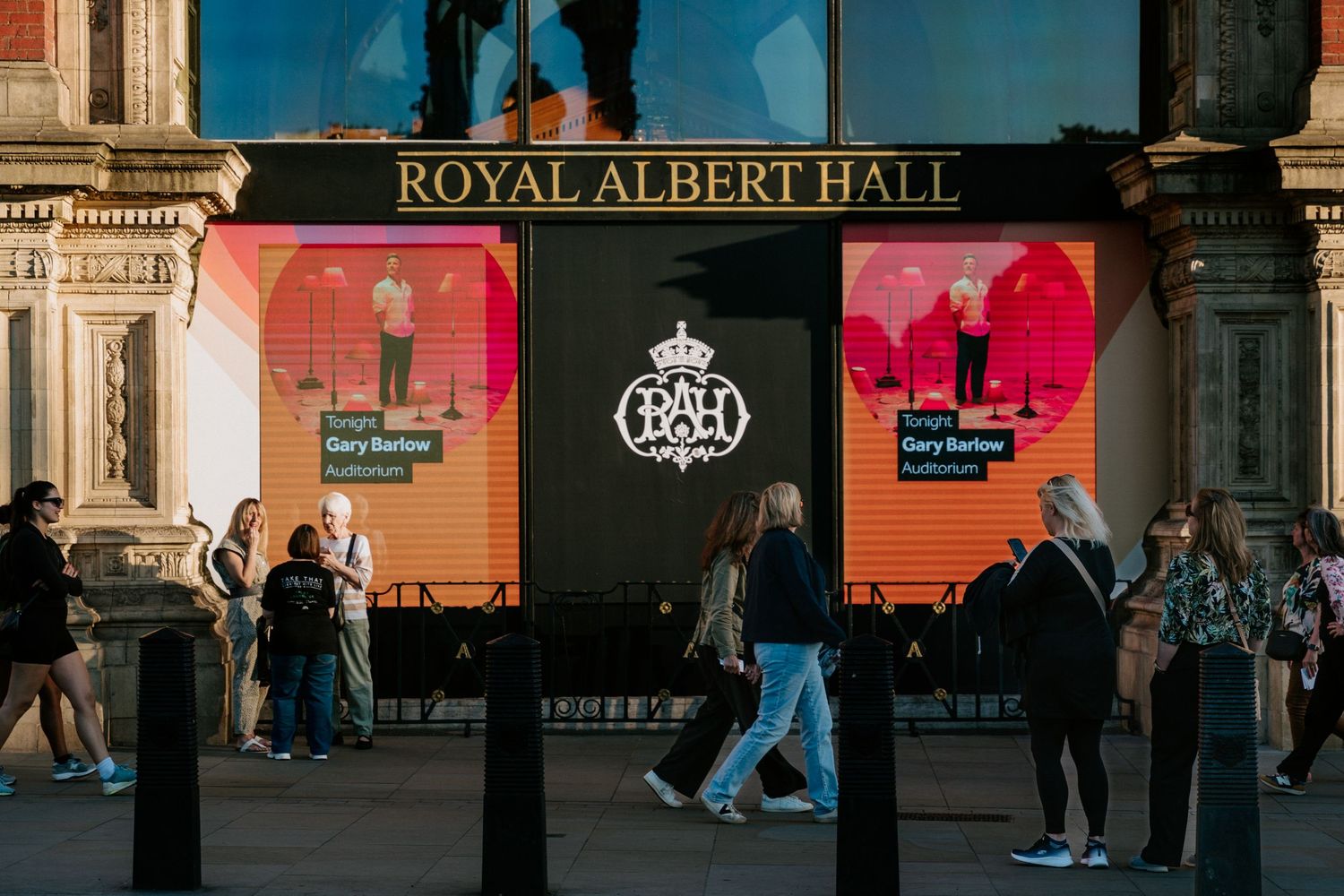 Exterior view of the iconic Royal Albert Hall entrance sign in London.