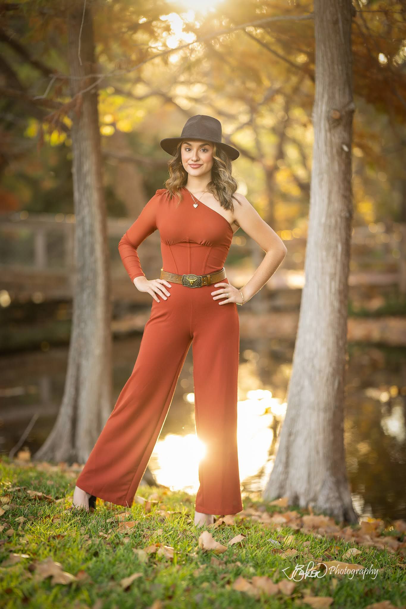 Lifestyle photo series of someone in a rustic burnt orange dress and brown hat posing in a sunlit autumn forest setting.