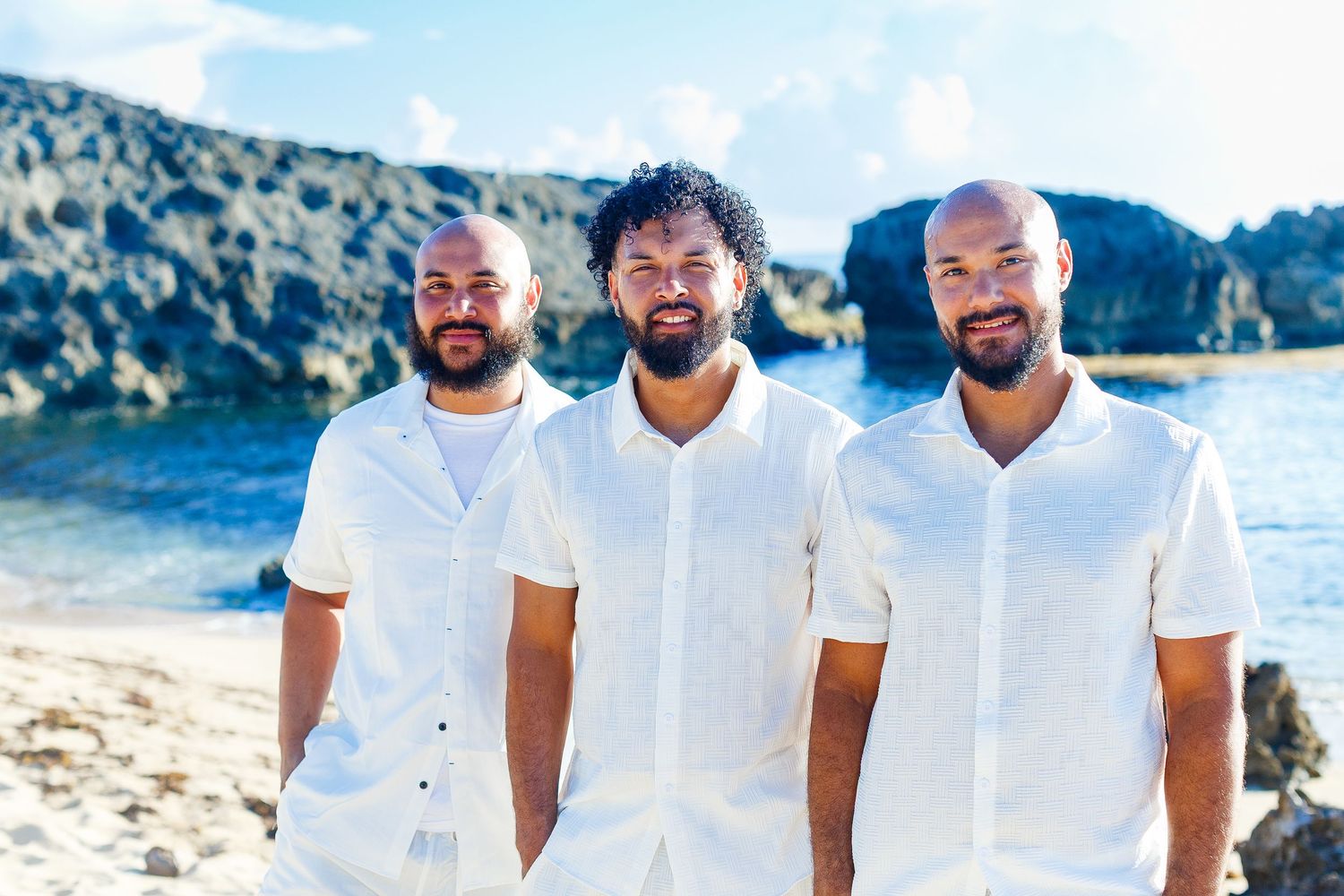Family portrait on the beach. Three brothers. Playa Mar Chiquita, Puerto Rico.