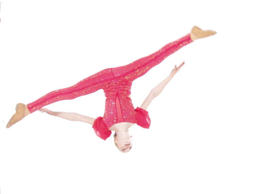 Pink leotard-clad gymnast performs a sophisticated tumbling sequence on white background.
