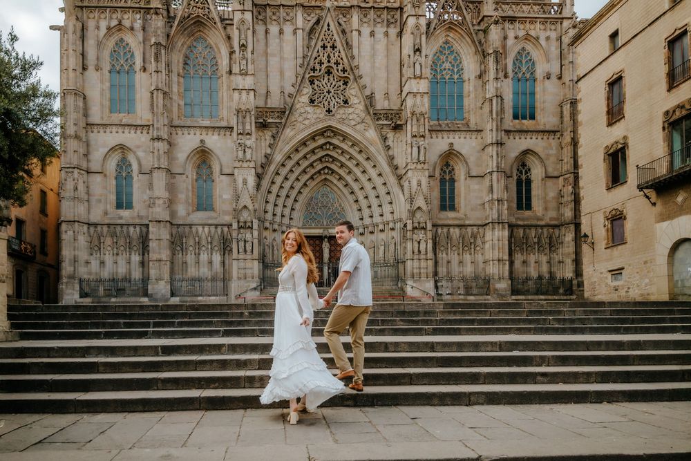 Kayla glowing in the golden Barcelona light during her maternity shoot in Old City.