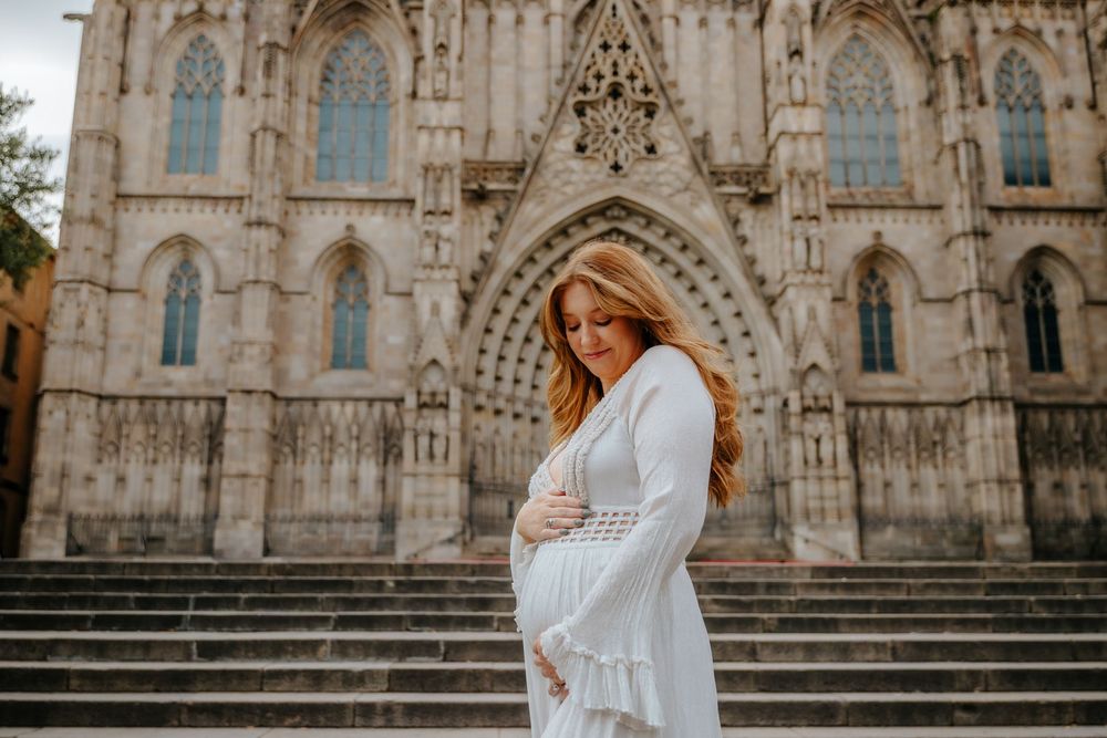 Couple celebrating their baby girl news surrounded by Old City’s architecture.