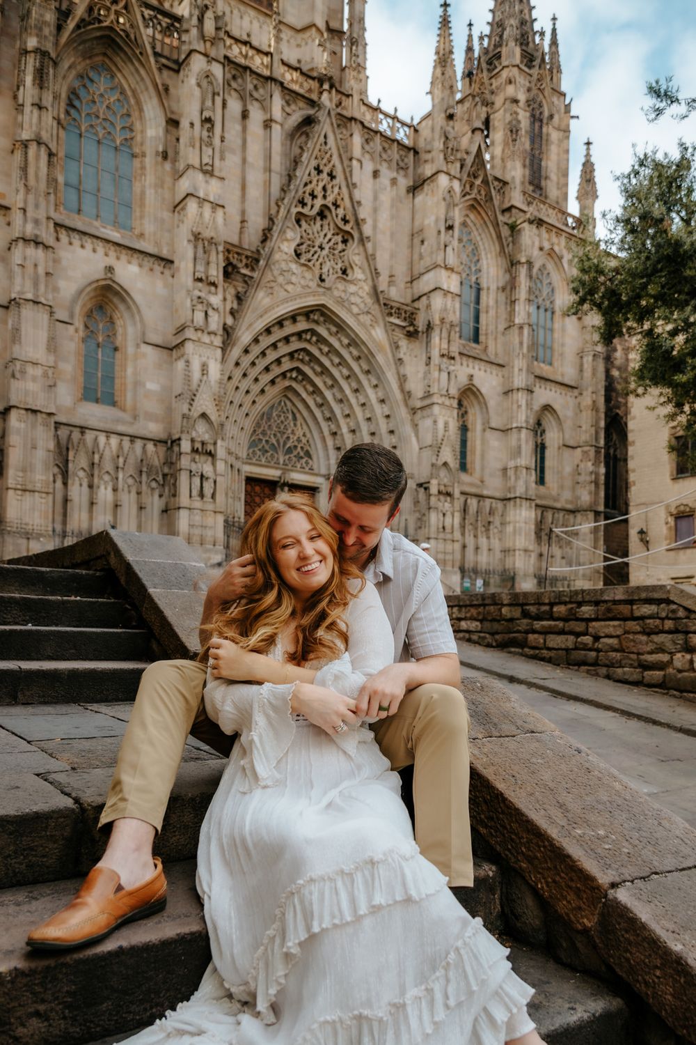 Magical maternity photoshoot moment with cobblestone streets and historic charm.
