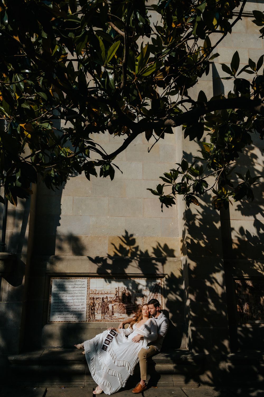 Sweet surprise gender reveal captured during maternity photoshoot in Old City Barcelona.