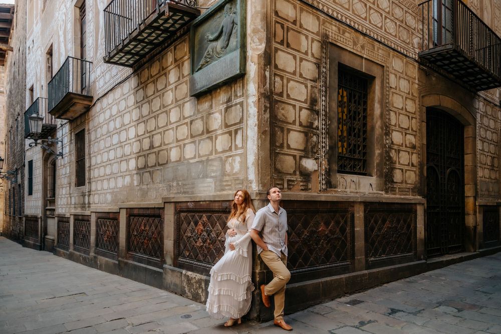Sweet maternity photoshoot moment of Kayla & Chad walking hand in hand through Old City.