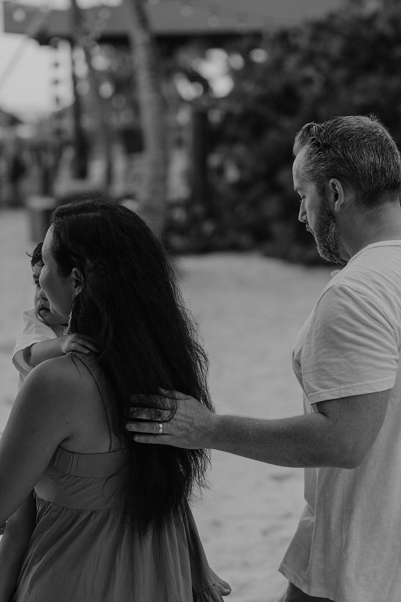 Candid moment of parents walking together at La Zebra Hotel, editorial-style family portraits.