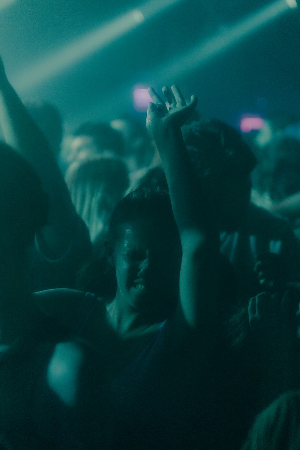An individual dancing in a club