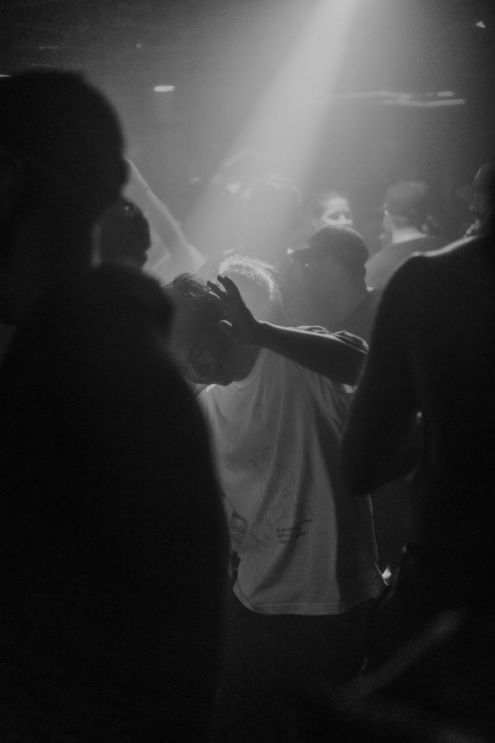 An individual dancing in a club