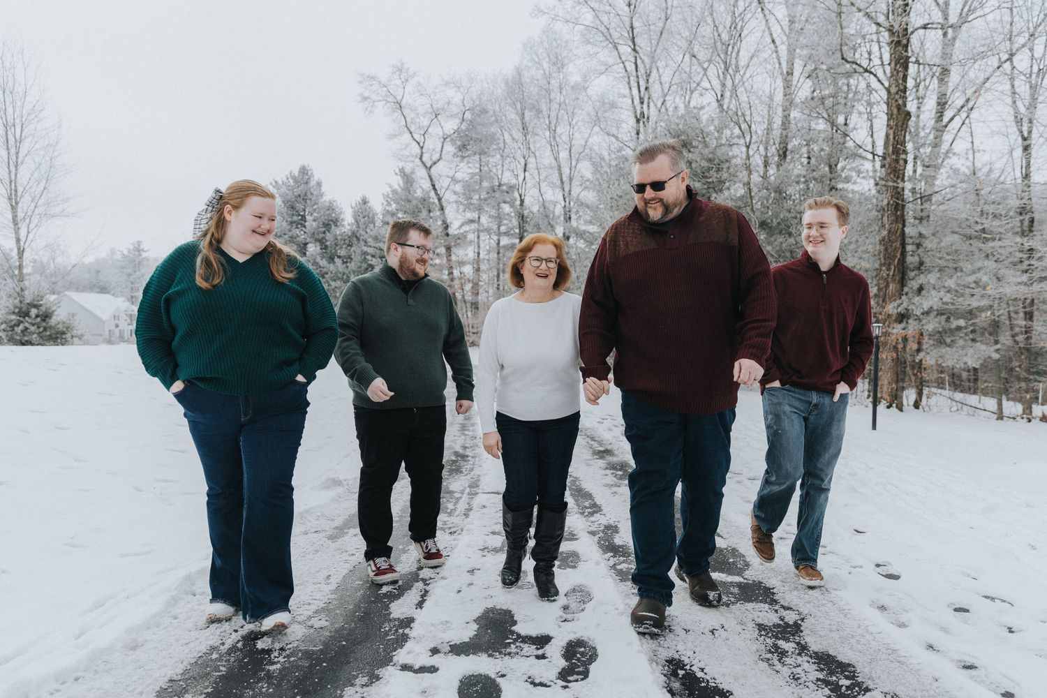 family walking in snow