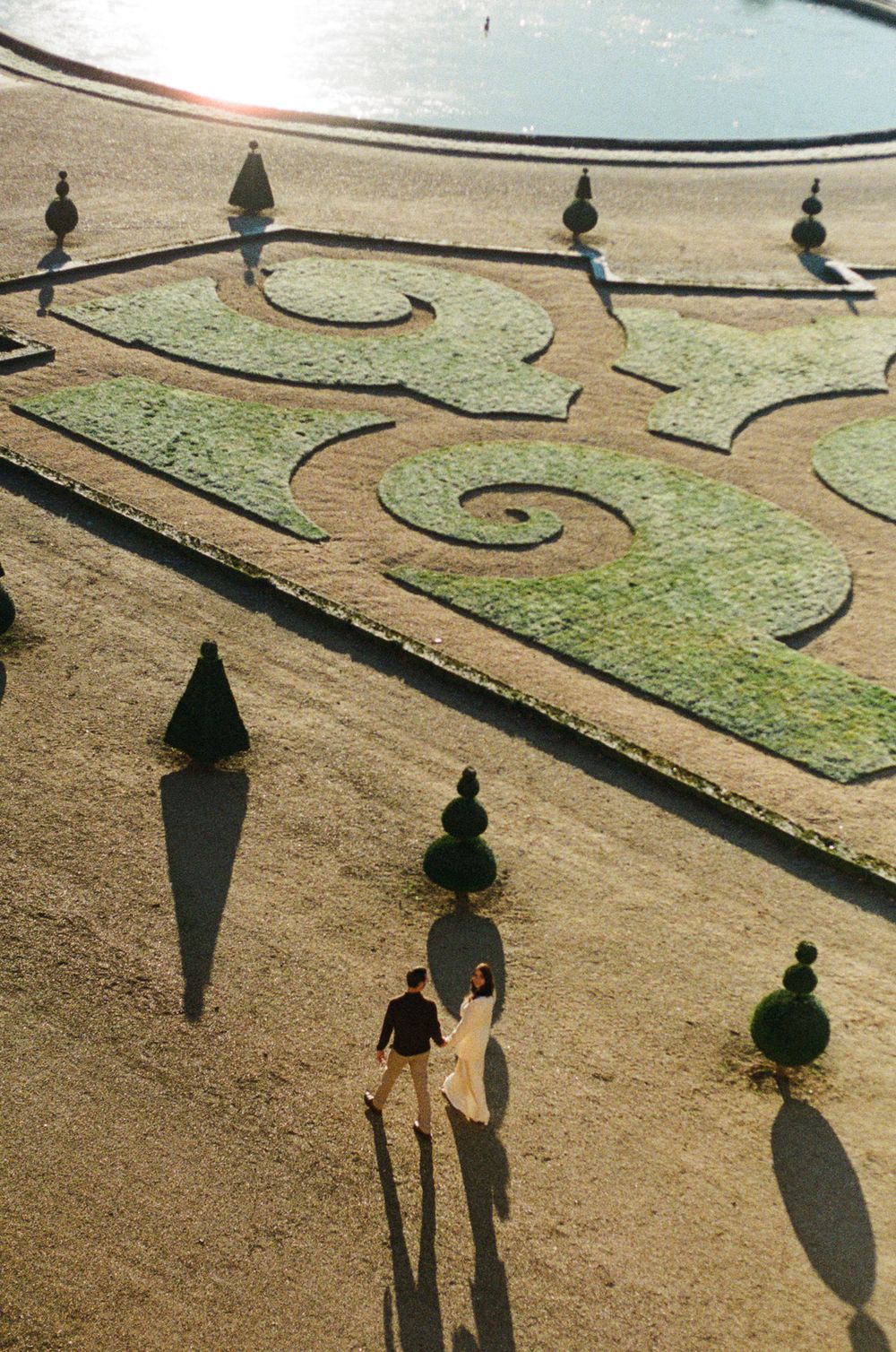 Versailles L'orangerie garden engagement shoot on film photography. Paris luxury engagement locations. Paris garden photoshoot. Paris.