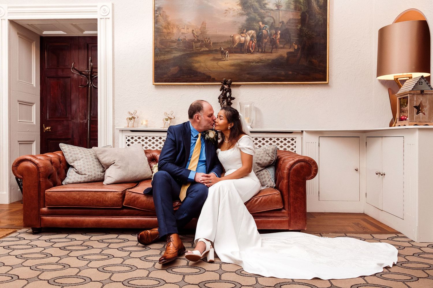 A romantic moment just inside the main entrance at Storrs Hall.