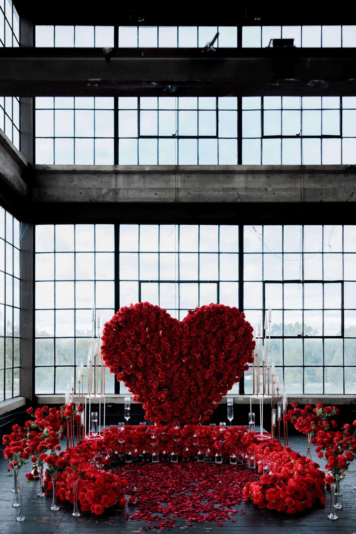 Modern luxury proposal setup with red roses and soft lighting