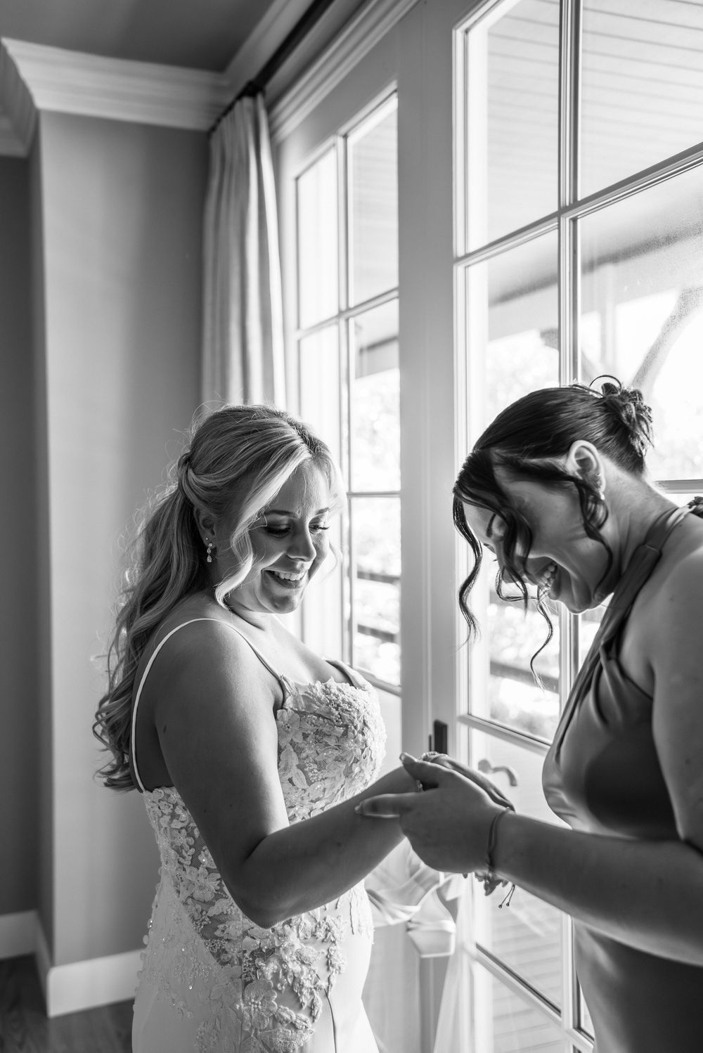 Black and white photo sequence captures intimate getting ready moments through window light.