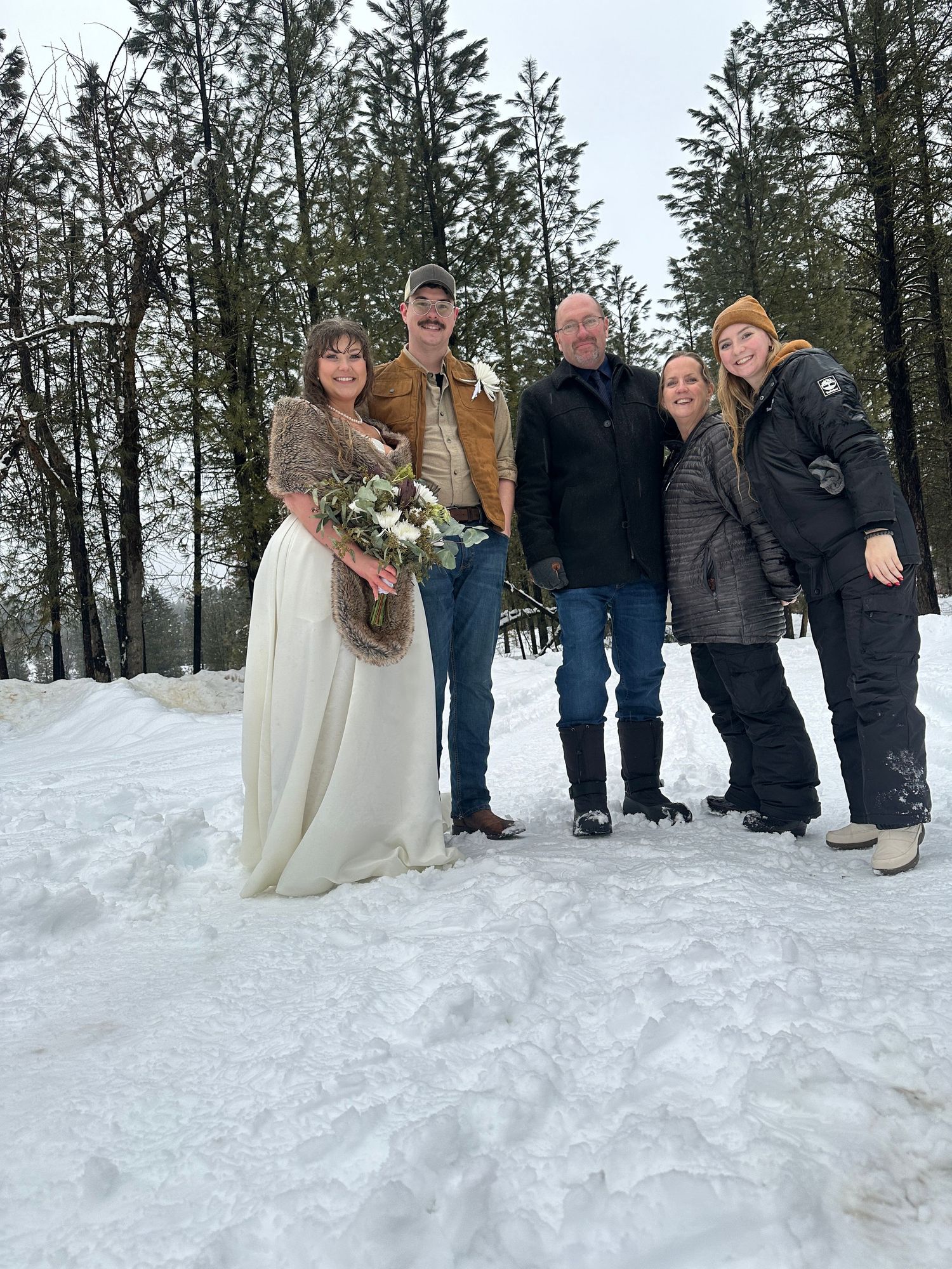 Winter elopement bride and groom with milestones studios