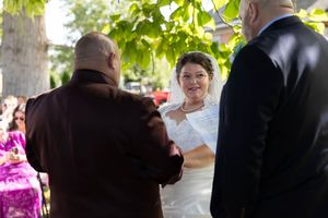 Bride smirking at officiant during wedding vows