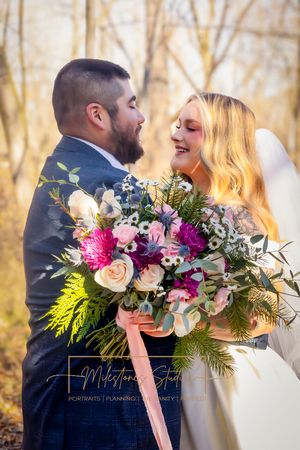 florals by Milestones Planning bridal bouquet pinks burgundy and white and green