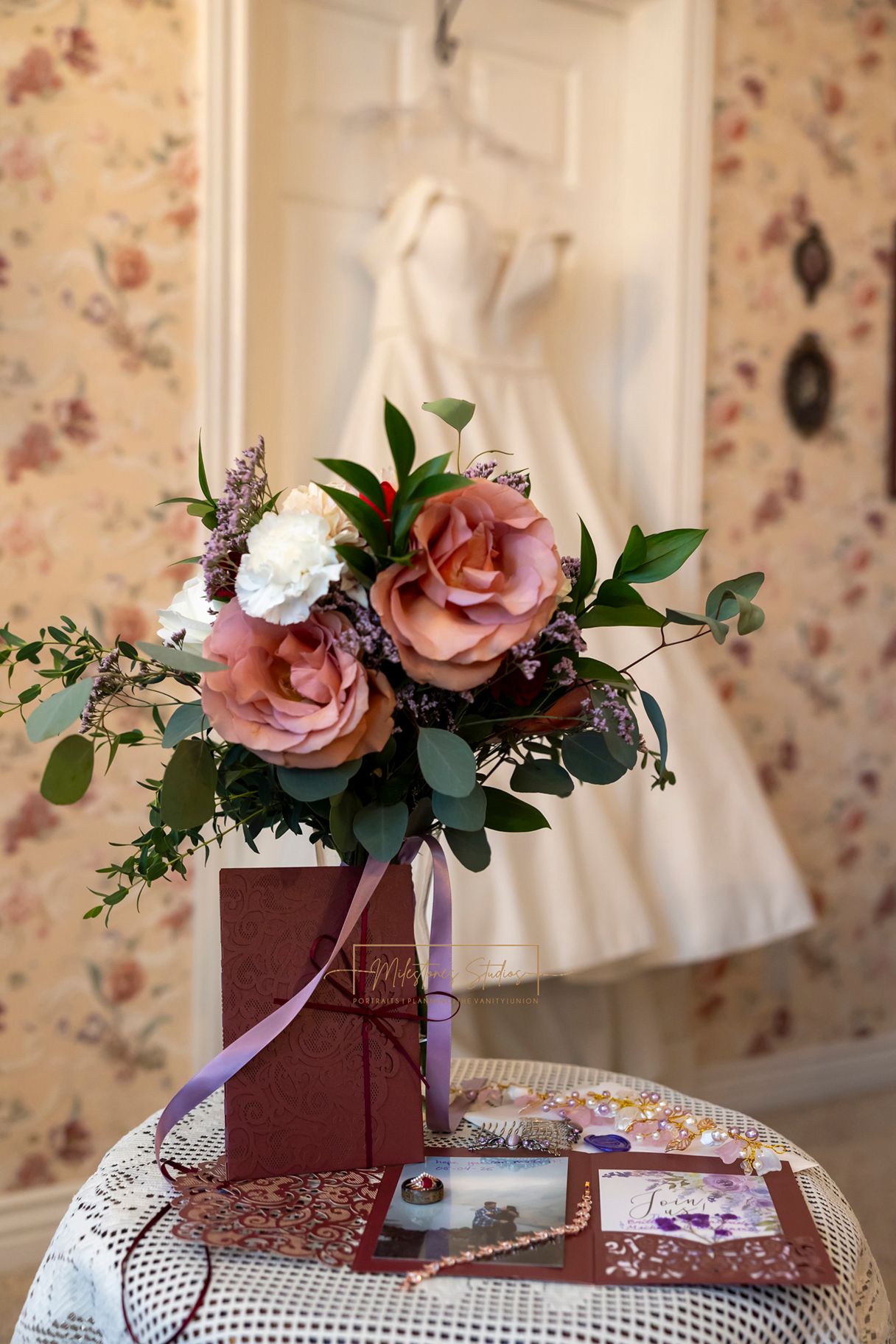 wedding florals by milestones wedding planning with details, dress and lay flat