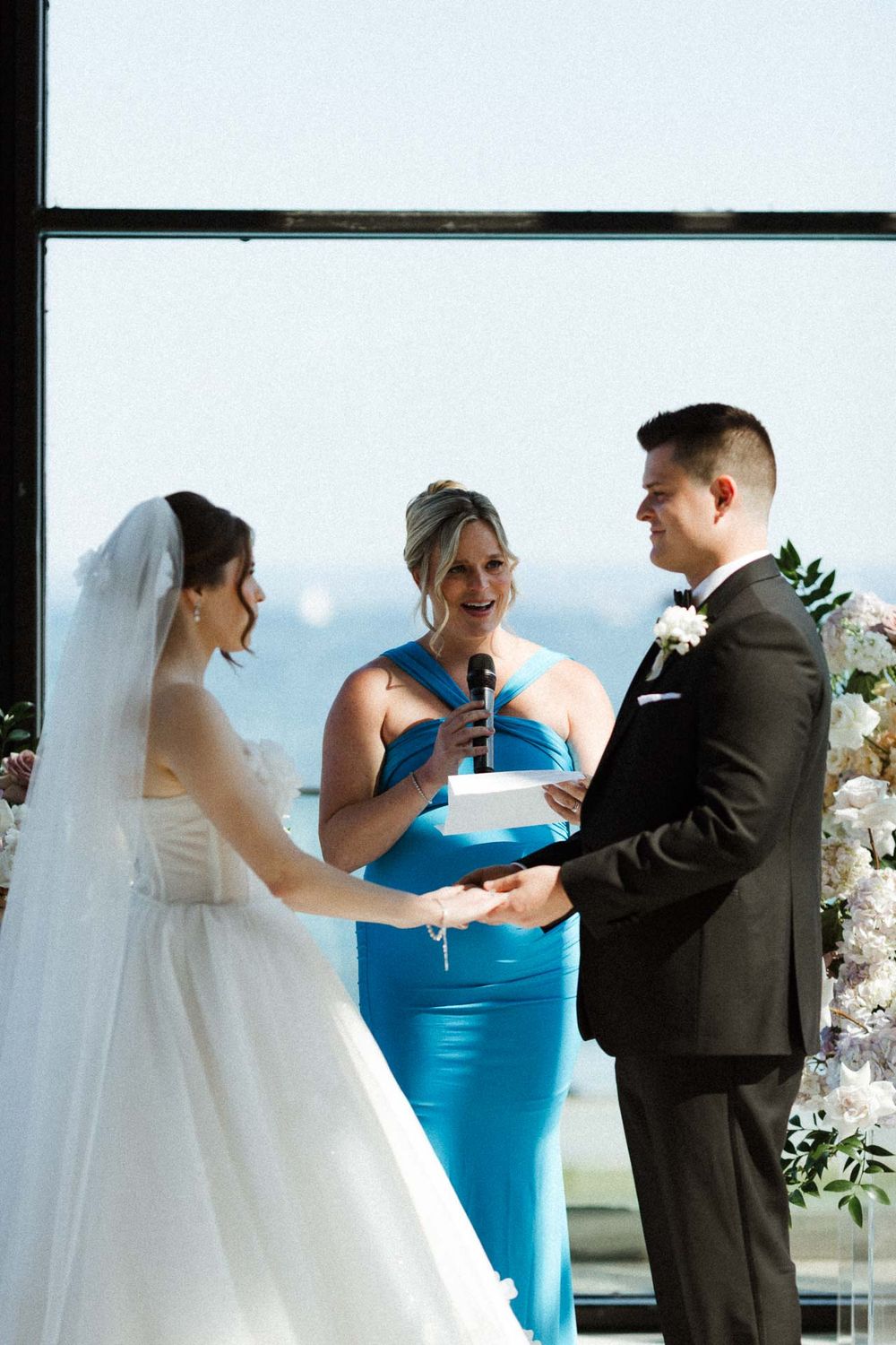 A sequence of candid wedding moments showing the bride and bridesmaid sharing laughter during the ceremony.