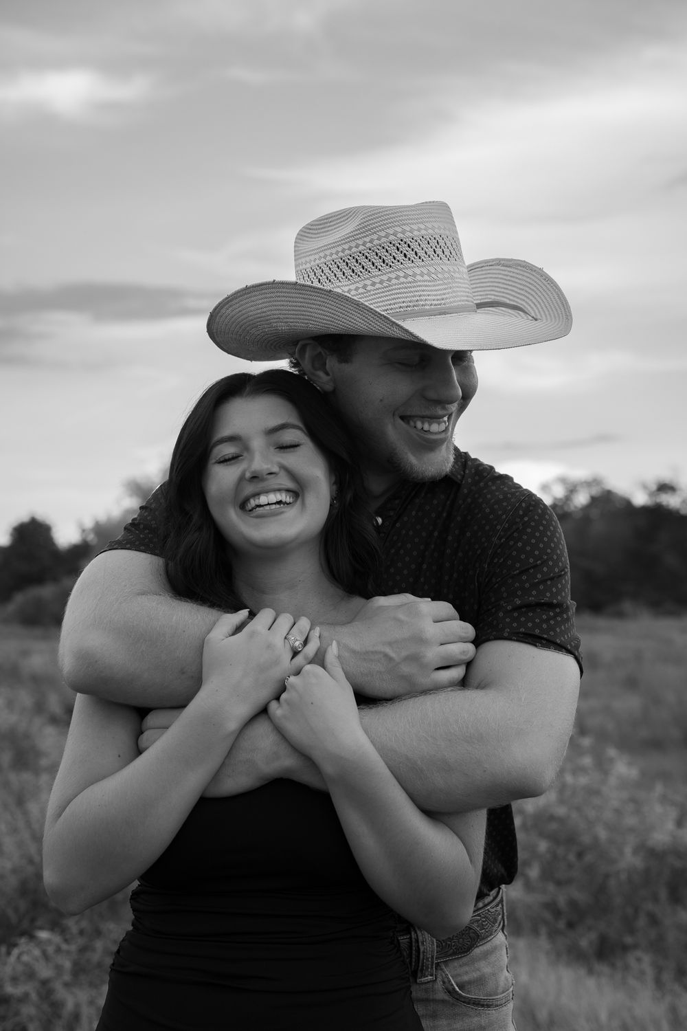 Black and white photo sequence showing a playful couple embracing outdoors in a field with one wearing a cowboy hat.