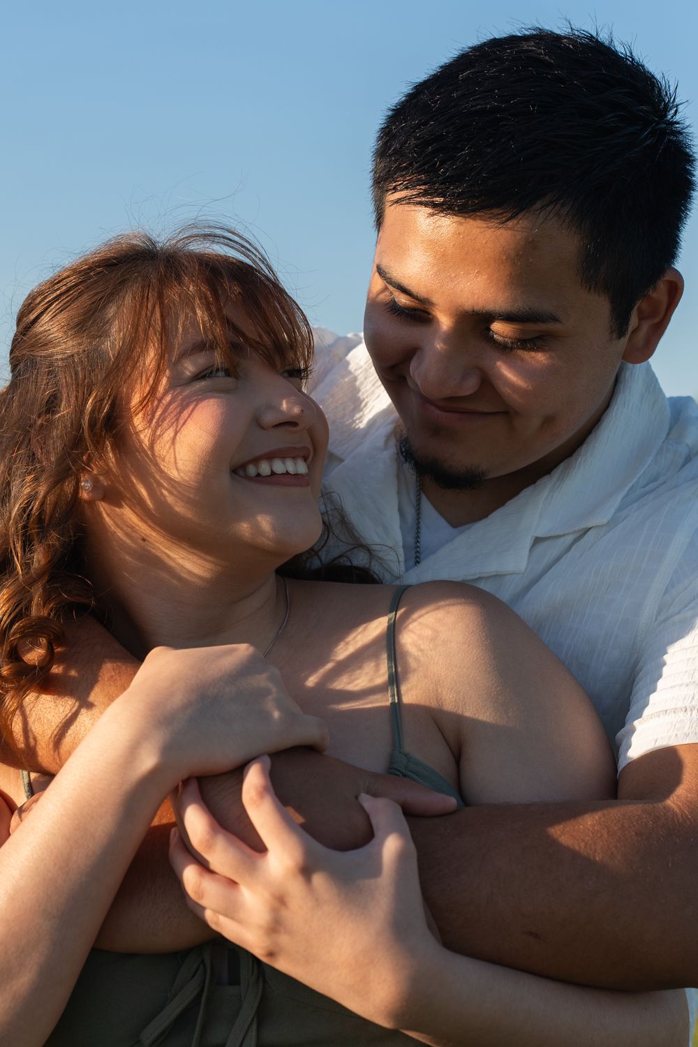 couple posing together in a loving embrace