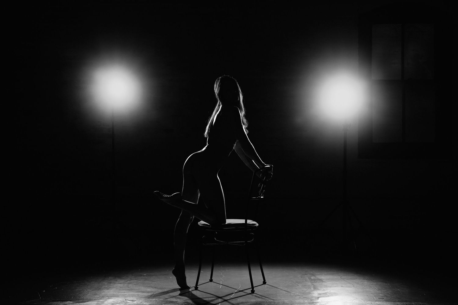 David G Holt Photography - Minimalist studio dance photograph with stark spotlight illumination.