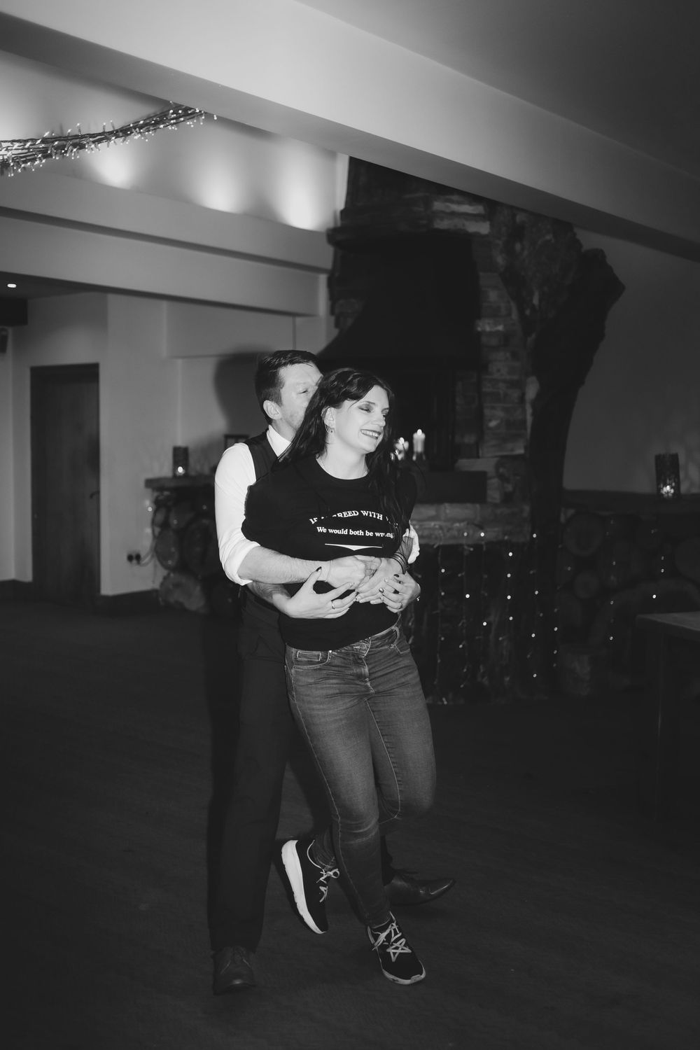 A sequence of black and white dance movement photos showing a person practicing steps in an indoor studio space.