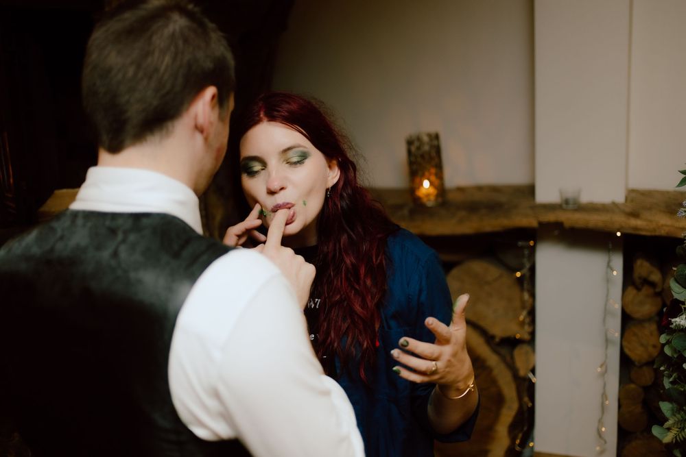 A series of dance floor moments captured at a dimly lit reception venue with stone walls and ambient lighting.