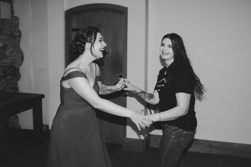 A sequence of black and white photographs showing dance partners practicing steps and movements together.
