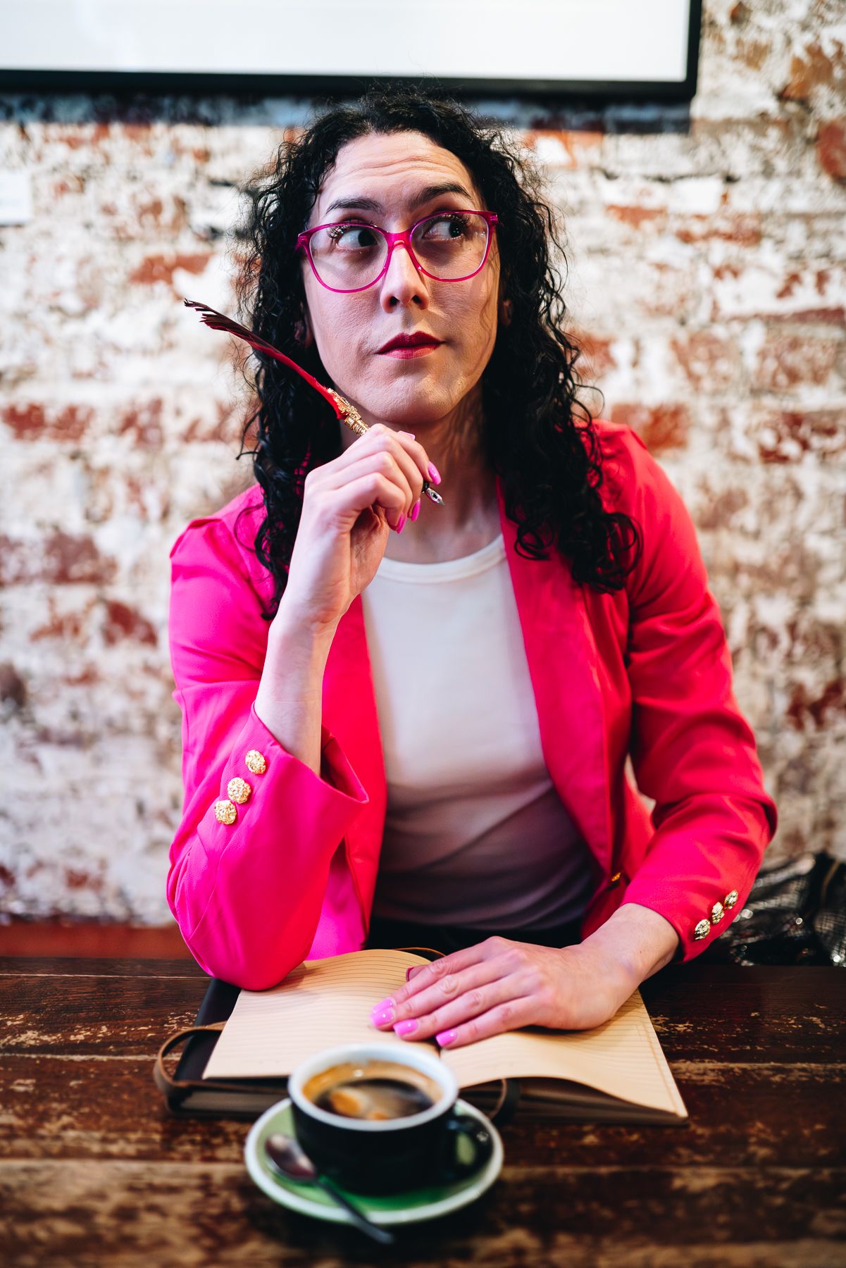 Melbourne branding photo of writer in red blazer and pink glasses with coffee and notebook—perfect for lifestyle and food styling photograph