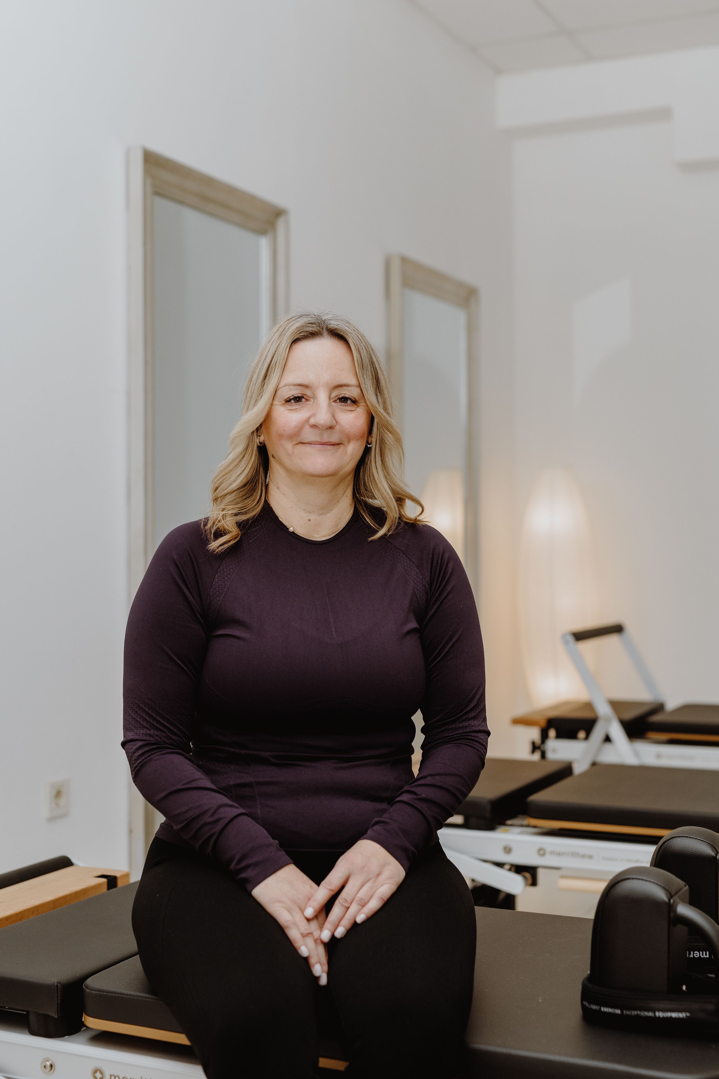 Portrait of the Pilates studio owner in Zagreb in brand photography to reflect their professionalism and warmth.