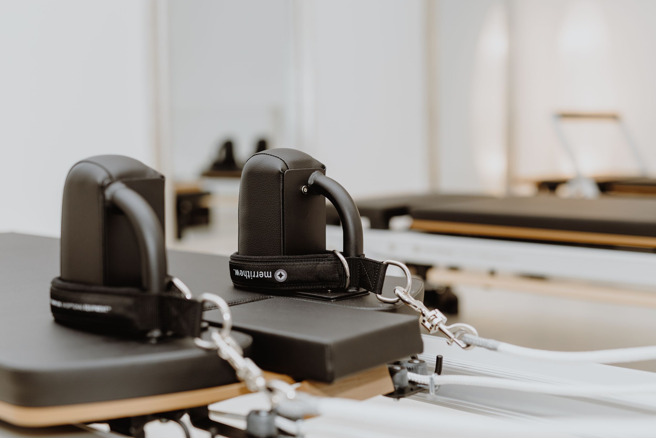 Pilates reformer in a Zagreb studio, focusing on the equipment’s precision and professional setup in a brand photoshoot.