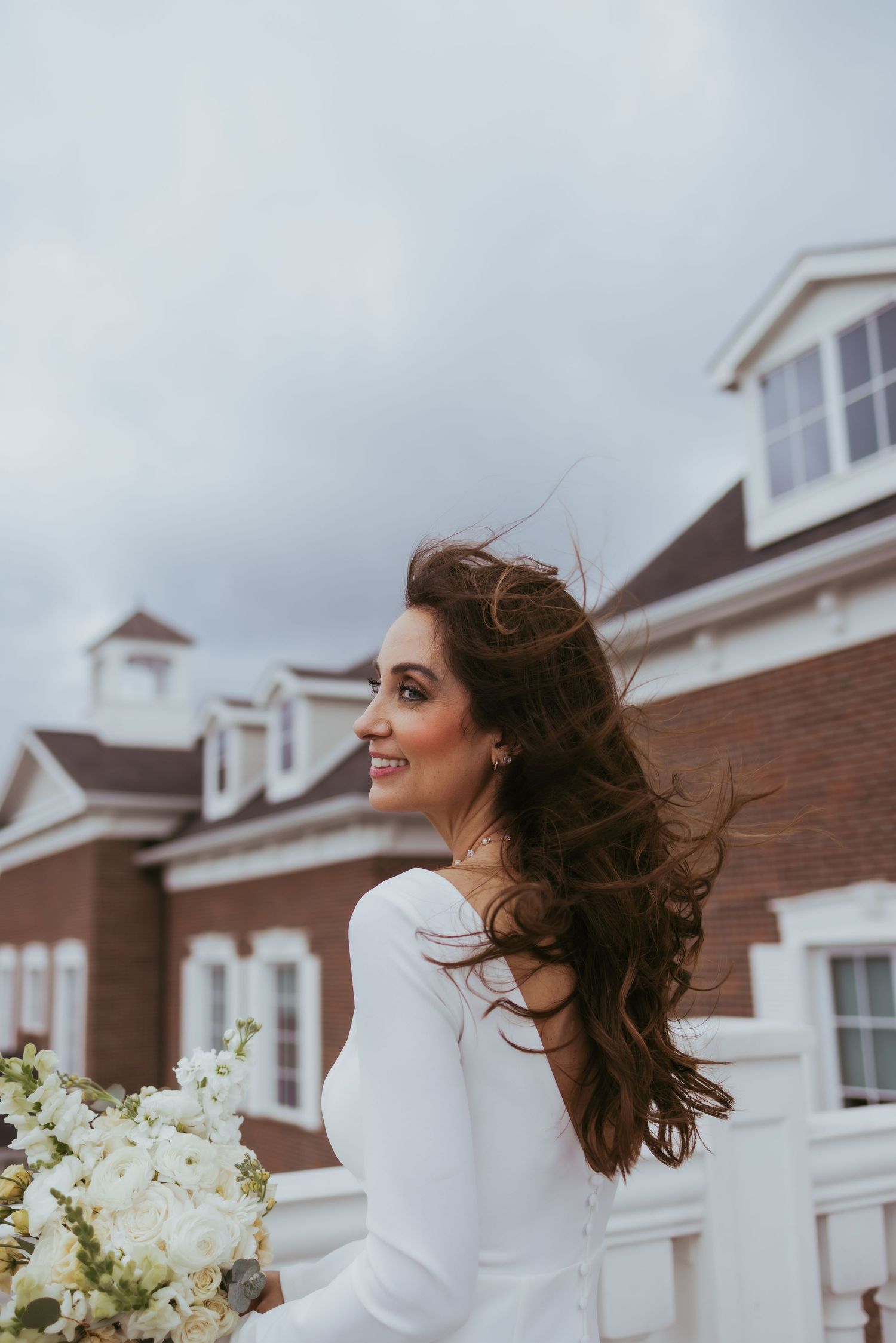 Bridal portrait on a windy day after getting married at Holliday Farms in Zionsville, Indiana