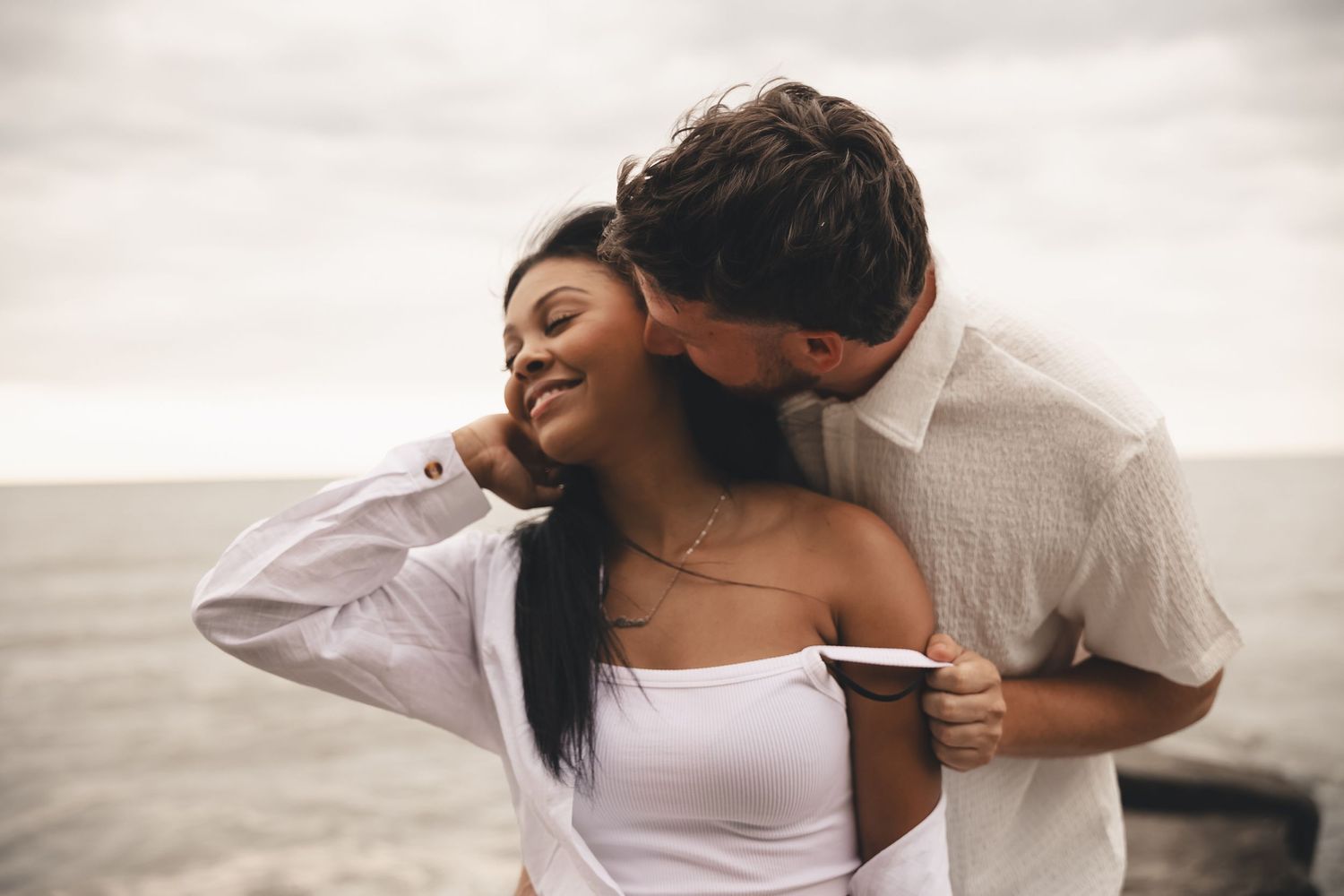 Intimate lakeside couples session in Cleveland Ohio. Warm, playful photography celebrating authentic moments and connection.
