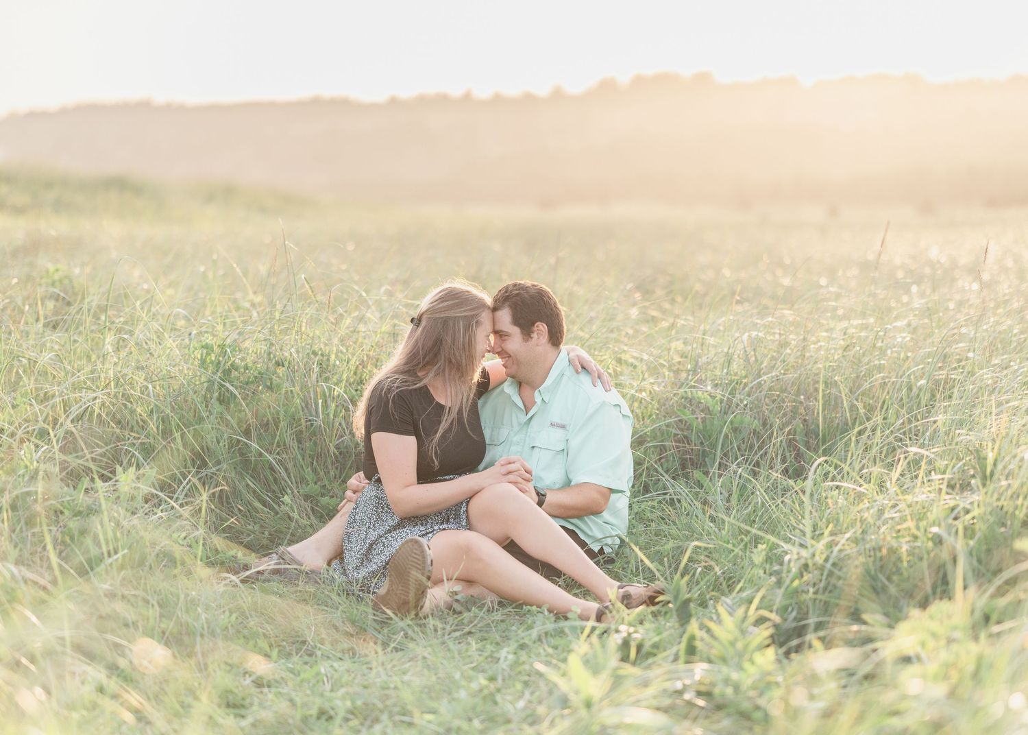 A gorgeous couple in the sand dunes for the perfect golden hour pre-wedding session